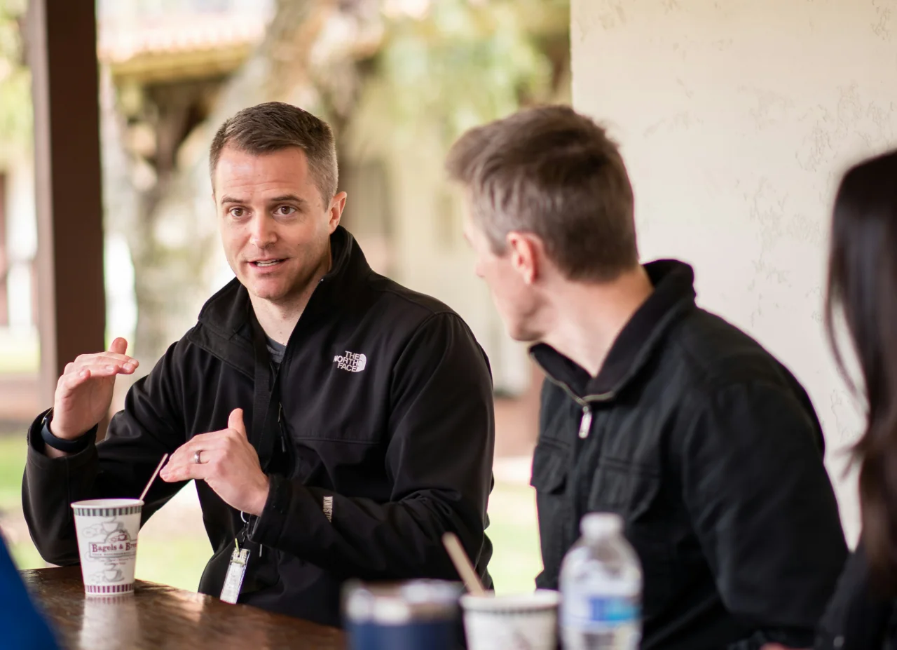 Small group talking around a table