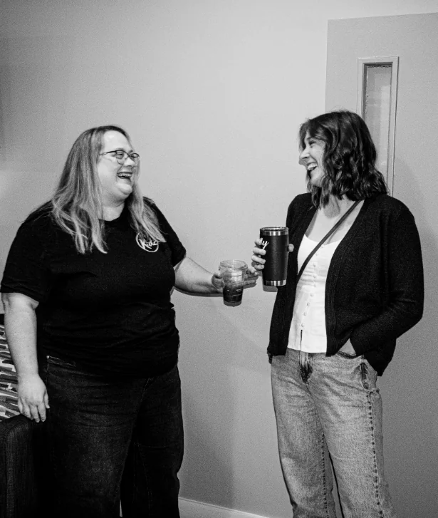 Two women talking and laughing