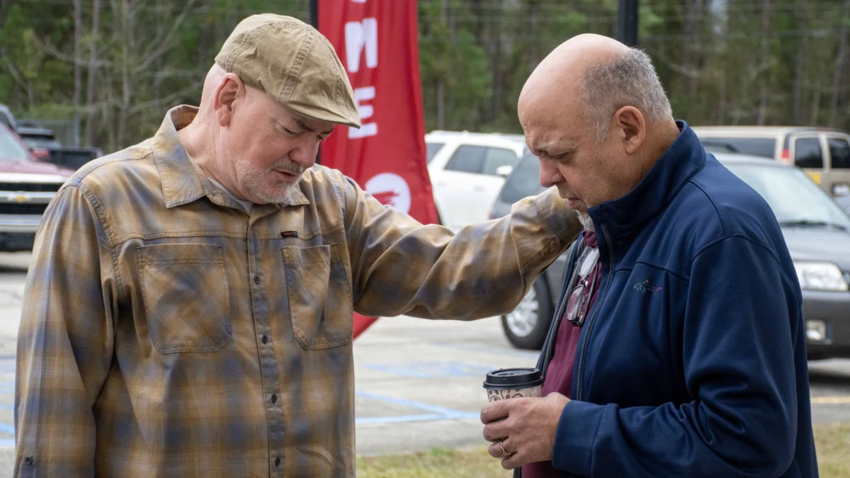 Two men praying together