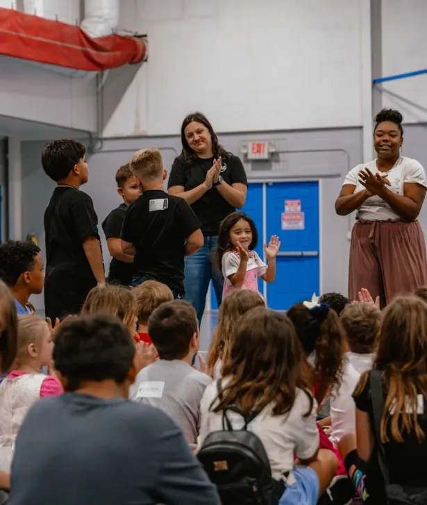 Kids and leaders cheering together
